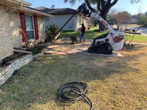 foundation repair using auger on home exterior