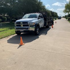 brown foundation repair work truck parked at customer's home in dallas, tx