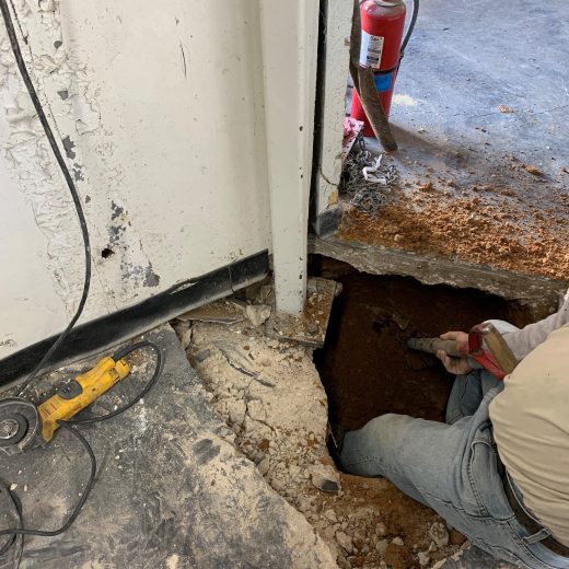 slab broken for interior foundation repair in warehouse